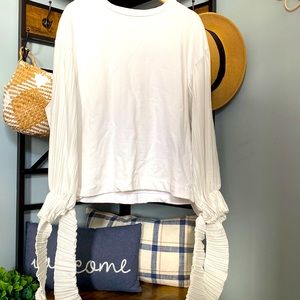 Zara white sweater with ruffles details .